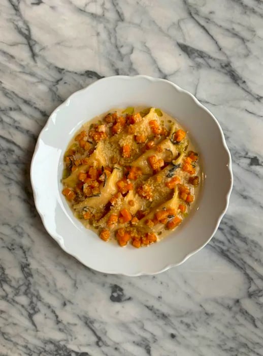 Aerial view of a dish featuring stuffed pasta.