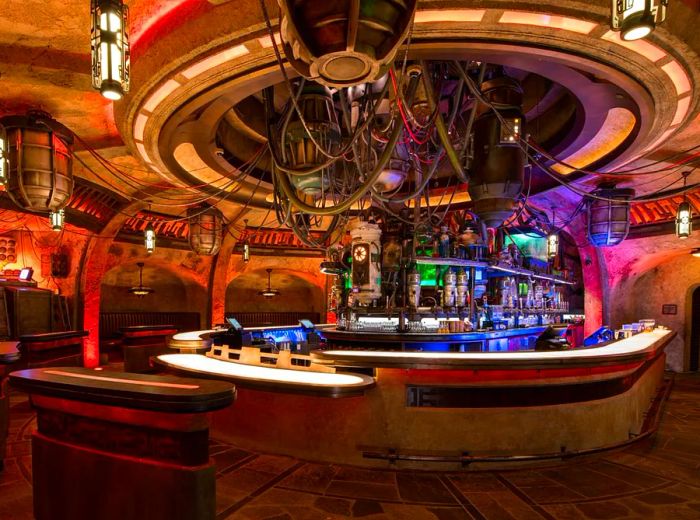 The interior of the bar resembles a set from “Star Wars,” featuring numerous tubes and vibrant glowing elements.