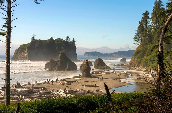 Tourists explore Ruby Beach within Olympic National Park, Washington State, USA