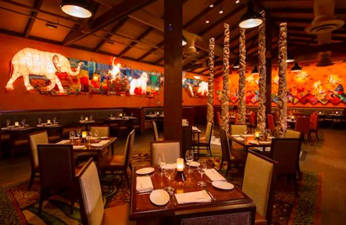 The interior of a restaurant adorned with charming animal-themed artwork on the walls.