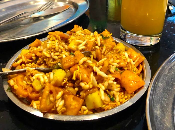 A tin filled with bhel puri.