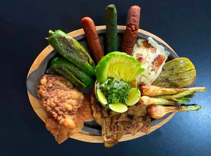 A plate featuring an assortment of mixed vegetables and plant-based meat alternatives.