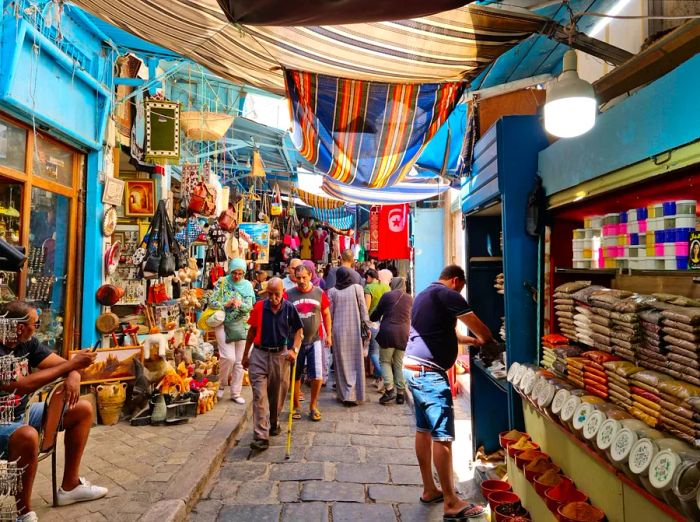 Visitors strolling through the medina district of Tunis, Tunisia