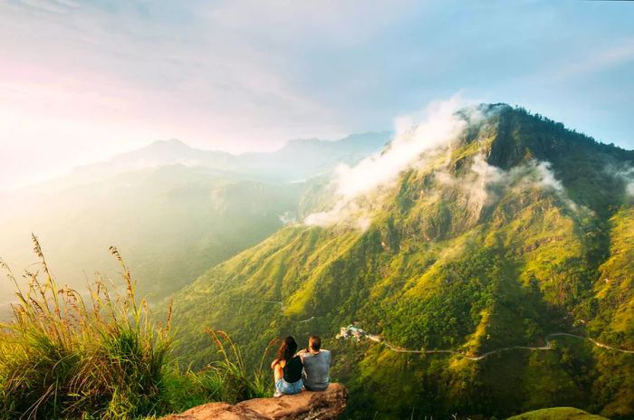 A couple enjoys the stunning view from a lookout in Sri Lanka.