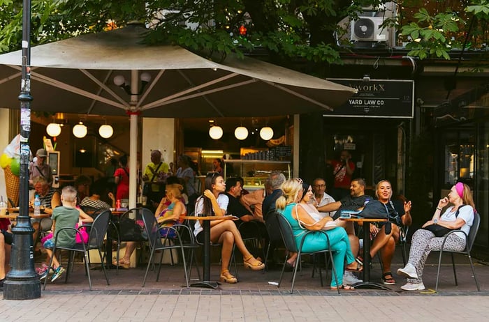 On a warm day in Sofia, people enjoy sitting at outdoor cafes along Vitosha Boulevard.