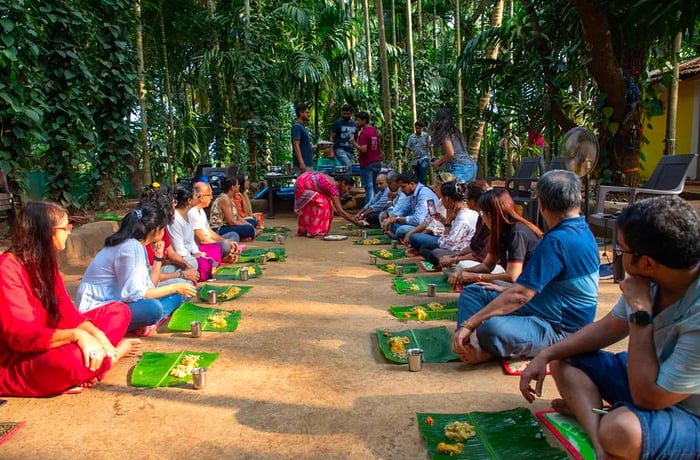 Guests on the tour enjoy their meals served on leaves while seated on the forest floor.