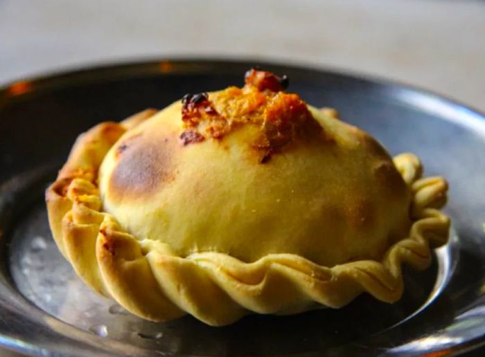 A beautifully browned empanada.