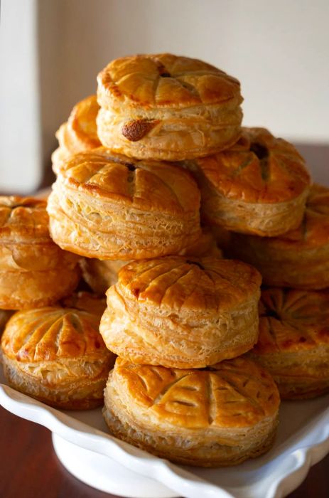 A collection of small galettes arranged on a cake stand.