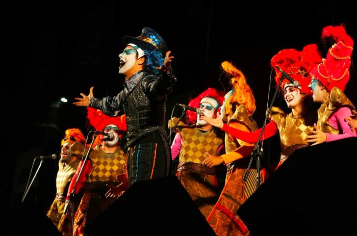 Costumed performers with face paint during a carnaval murga show in Montevideo, Uruguay, South America.