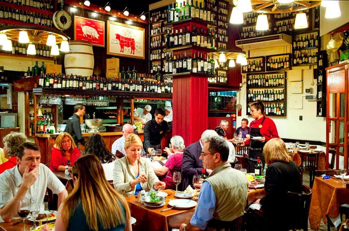 Diners enjoying meals at a bodega in Buenos Aires