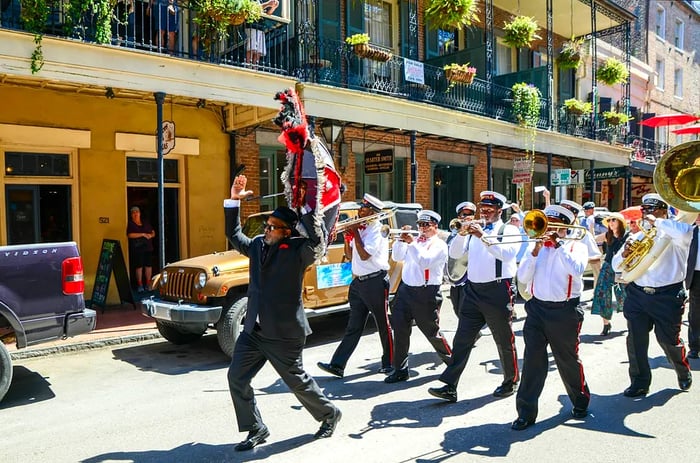 A Second Line band parades through the French Quarter in New Orleans, Louisiana.