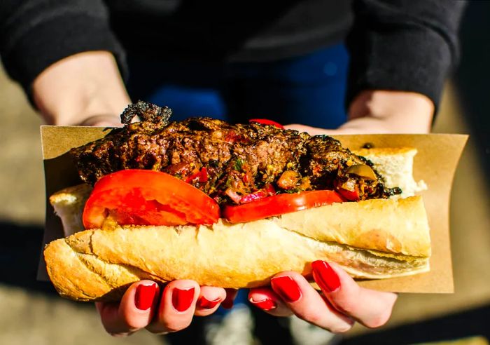 A sandwich featuring strip steak and chimichurri sauce in Buenos Aires, Argentina.