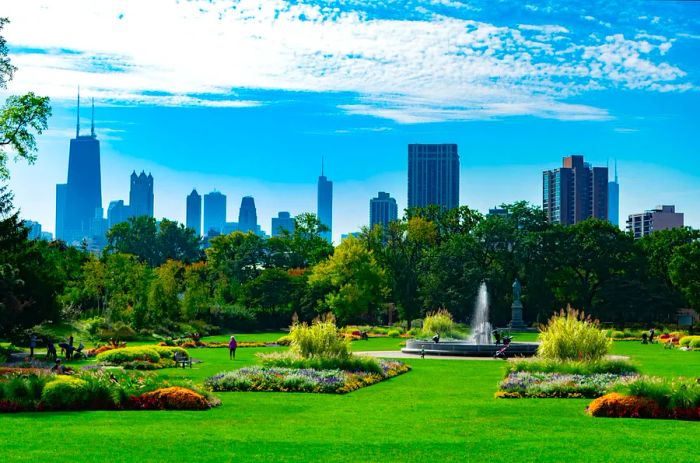 A vibrant garden scene filled with greenery and a fountain in Lincoln Park, Chicago, with the city skyline rising majestically in the background.