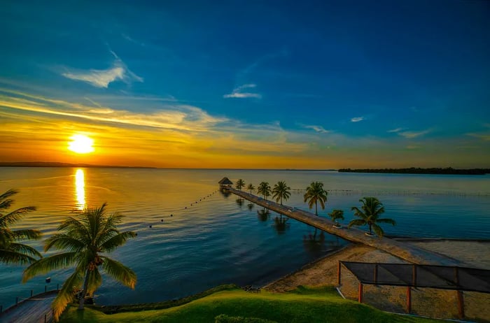 A stunning sunset casts its glow over Amatique Bay in Puerto Barrios, Guatemala.