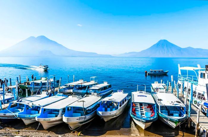 Ferry boats await along the shores of Lake Atitlán, Guatemala.