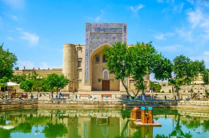 View of Lyab-i Hauz, a remarkable architectural ensemble from the 16th to 17th centuries located in the heart of Bukhara, Uzbekistan.