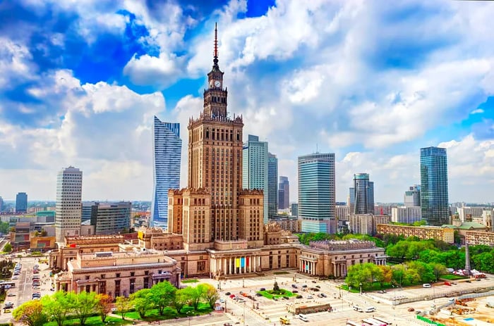 Aerial view of the Palace of Culture and Science alongside the modern business skyscrapers in Warsaw.