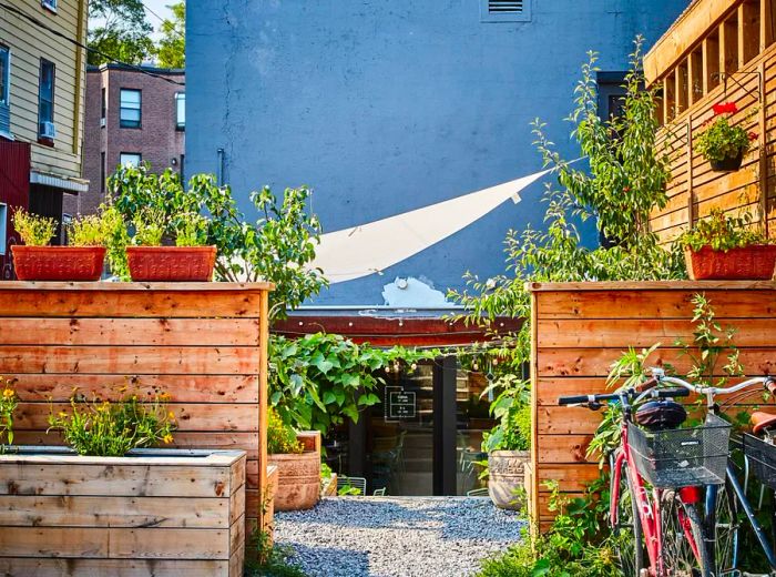 A cozy patio entrance sheltered by low wooden walls.