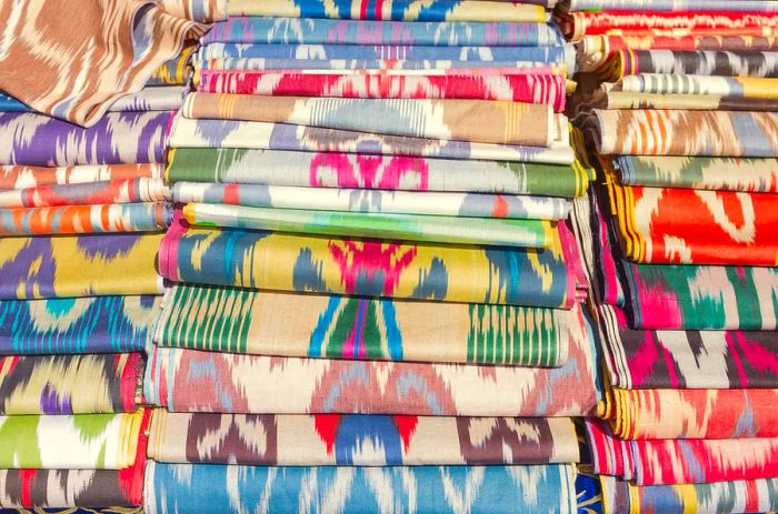 Rolls of traditional Uzbek fabric. Ikat Khan Atlas patterns. Authentic Uzbek material.