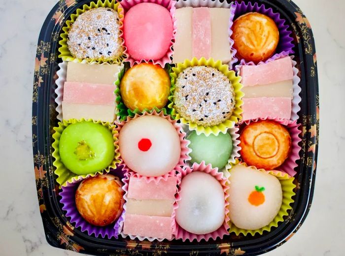 An aerial view of a container filled with colorful mochi.