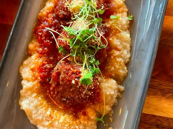 Meatballs served atop a creamy risotto bed.