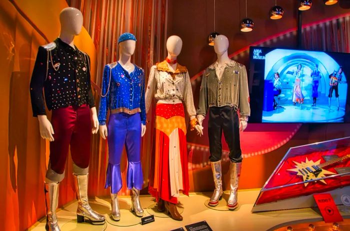 Iconic costumes worn by ABBA members on display at ABBA: The Museum in Stockholm.