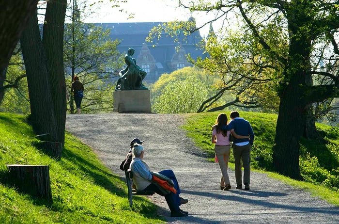 A winding path meanders through the lush greenery of Djurgården.