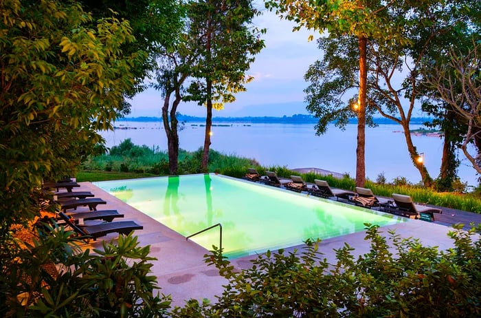 The pool at dusk at River Resort, Champasak, Laos.