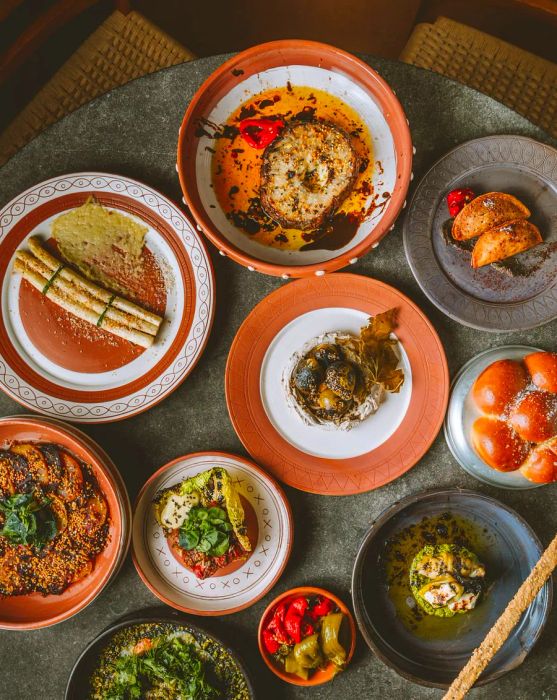 A bird's-eye view of a table filled with vegetarian dishes.