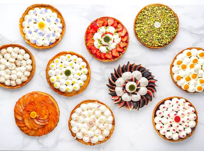 An aerial view of vibrant fruit tarts.