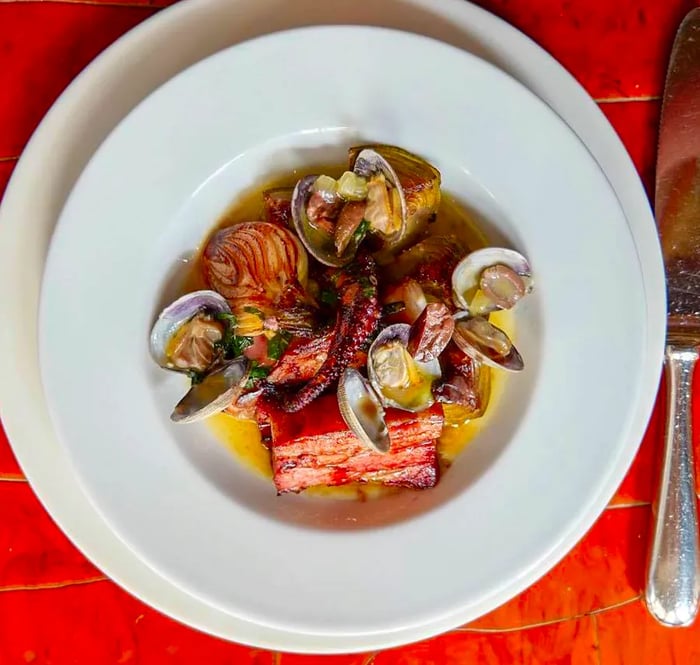 Aerial view of a seafood medley in a flavorful broth.