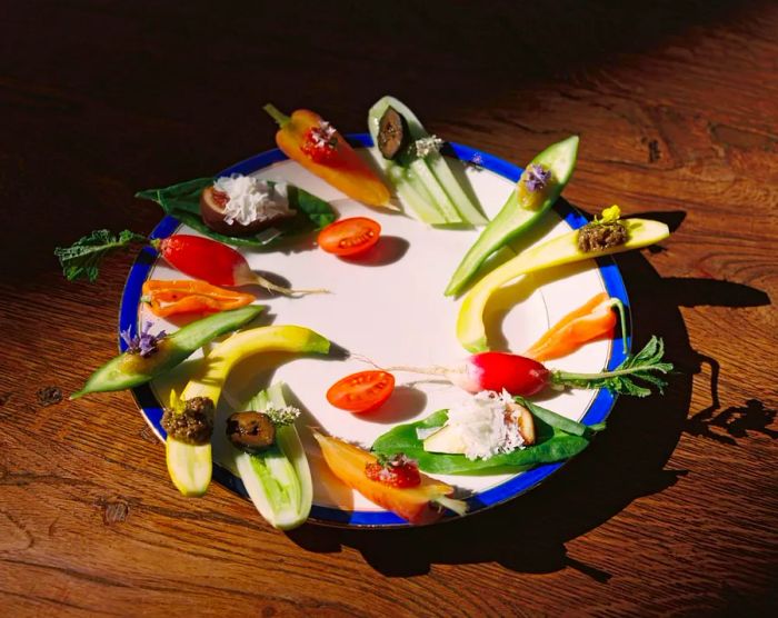 A dish featuring sliced vegetables with a variety of toppings.