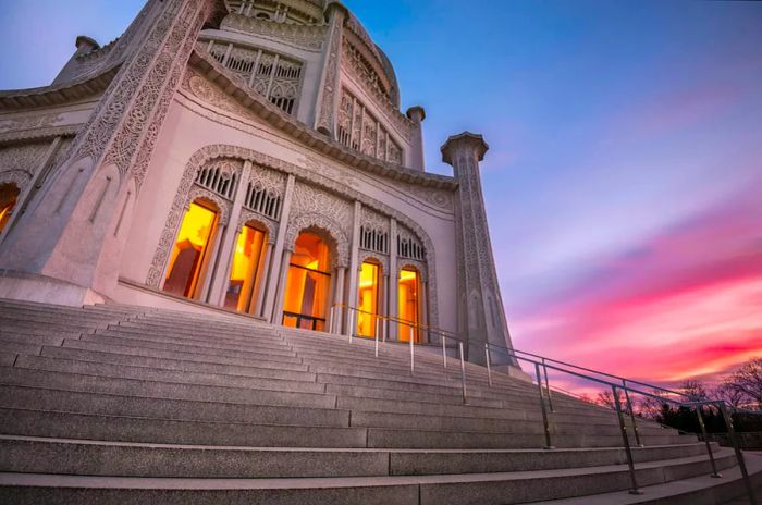 Baha’i House of Worship framed by a pink and blue sky