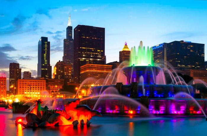 The illuminated Buckingham Fountain at sunset in Millennium Park, Chicago