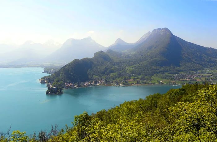 View of Lake Annecy and the surrounding mountains from Roc de Chère, France.