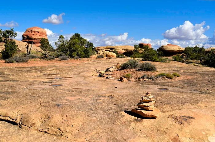 Cairns indicate the path from Elephant Hill to Chesler Park in Canyonlands National Park, Utah.