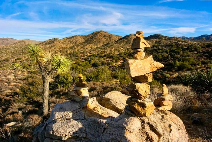 Close-up view of rock cairns made by visitors in Joshua Tree National Park.