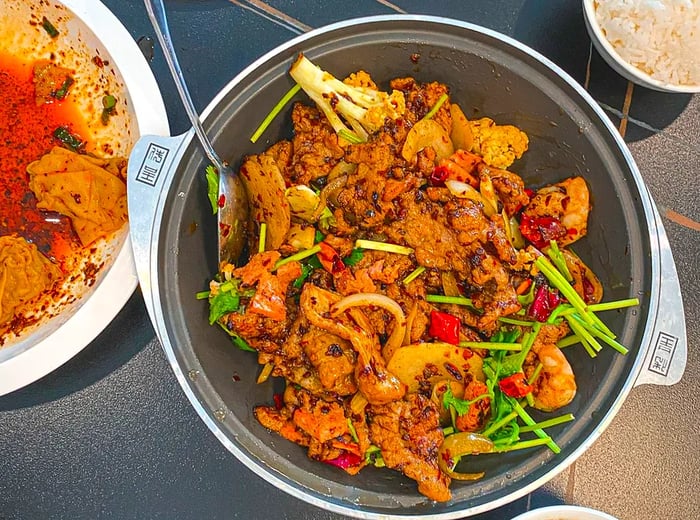 A plate featuring a combination of meat and shrimp.