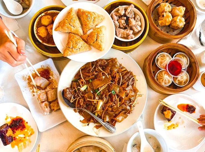 An array of dim sum delicacies elegantly laid out on a large table.