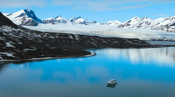 Cecilia’s boat anchored in the bay of Borebukta, surrounded by magnificent glaciers.