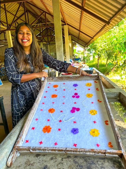 A woman demonstrates traditional papermaking techniques during a class in Chiang Mai, Thailand.