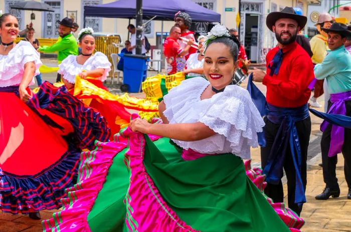 A folk group marches through the vibrant streets of San Jose, Costa Rica.