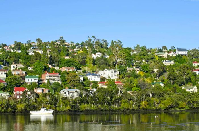 Homes perched on the hillsides above the Tamar River in Trevallyn, Launceston, Tasmania.