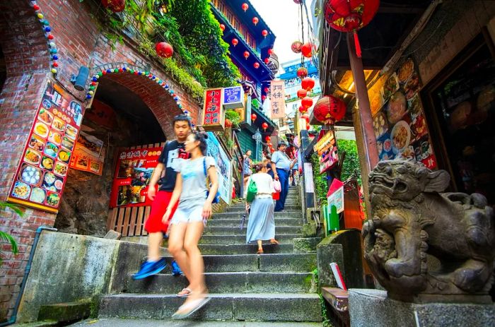 Stairs bustling with pedestrians in the coastal mountain town of Jiufen.