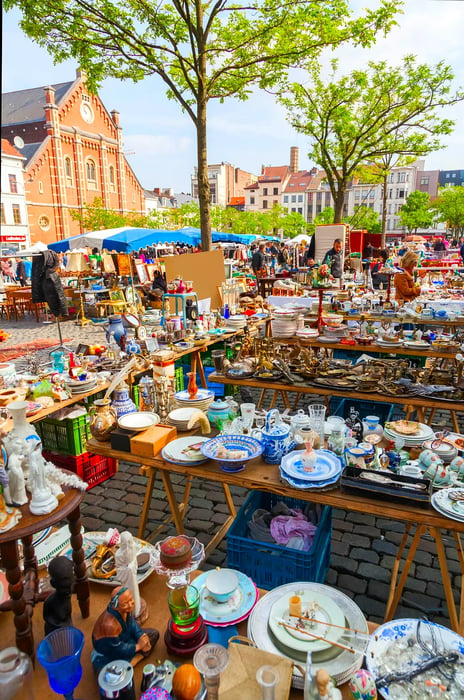 Discover a treasure trove of antiques and second-hand finds at a flea market in the Marolles district of Brussels, Belgium.