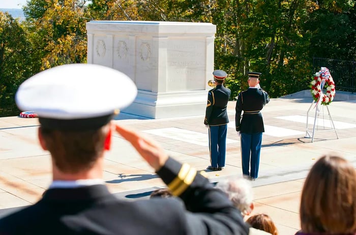 Witness the Changing of the Guard ceremony at Arlington Cemetery, specifically at the Tomb of the Unknown Soldier.