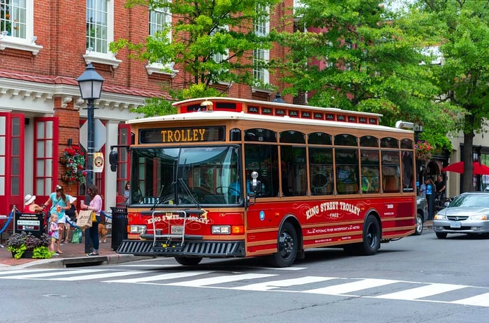 A trolley bus travels through Alexandria during the summer months.