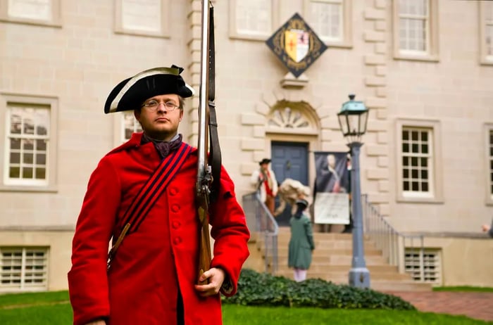 A performer in Revolutionary War attire, complete with a red coat and bicorne hat, at Carlyle House, Alexandria, Virginia, USA