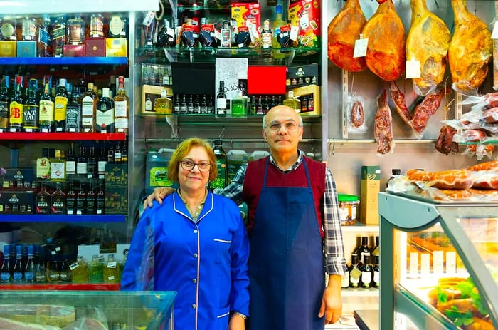 Shop owners posing for a photo