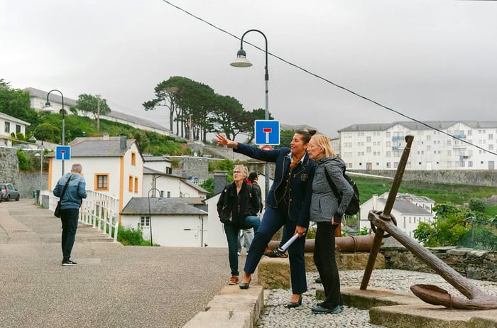 A tour guide shares insights with a tourist